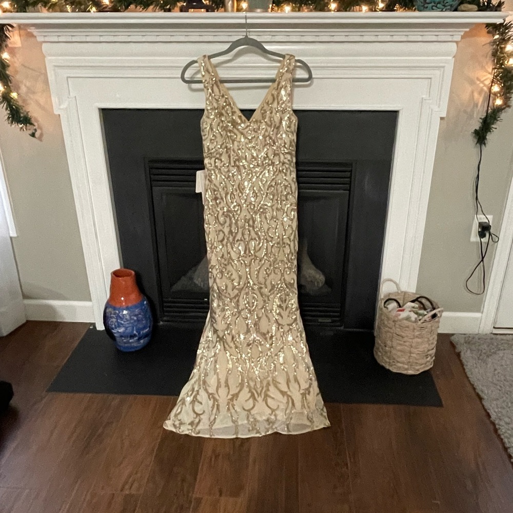 Beautiful fitted champagne colored gown.